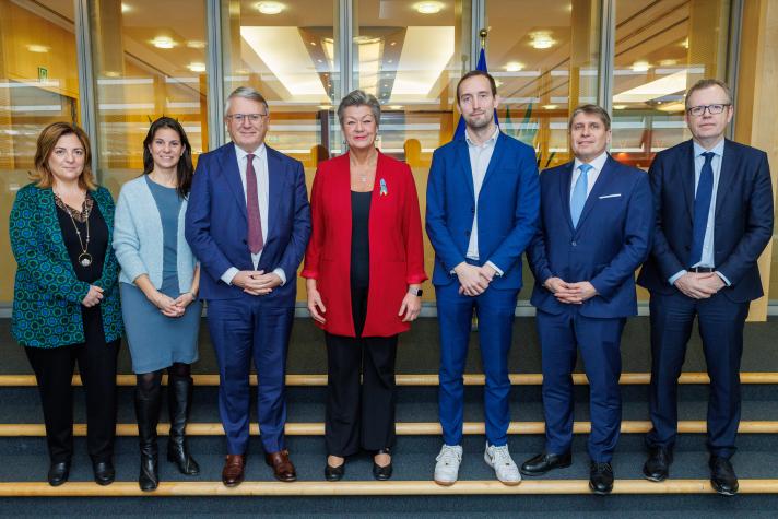 Group photo on steps of Economic and Social Partner representatives, Valeria Ronzitti, Mercedes Miletti, Ludovic Voet, Markus J. Beyrer, Ben Butters with Commissioners Nicolas Schmit and Ylva Johansson