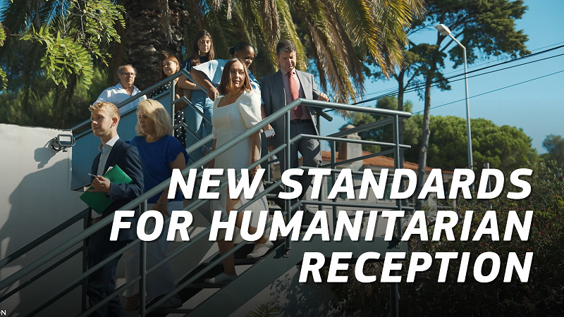 Photo of a visit of the reception centre. The text reads: New standards for humanitarian reception
