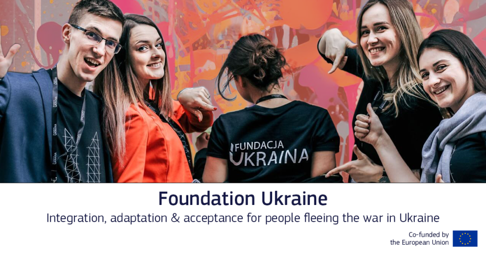 Staff members of the Foundation Ukraine NGO pose in front of the camera together, on a multicoloured graffiti-like background.