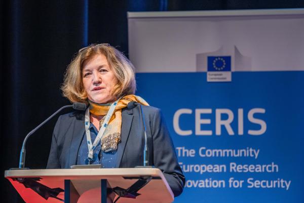 Director Marta Cygan for Innovation and Audit at DG HOME, European Commission speaking at podium for CERIS event