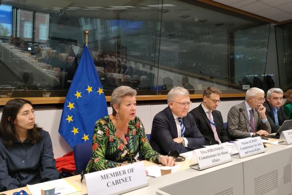 Commissioner ylva Johansson speaking to platform participants seated beside Commissioner Schmit
